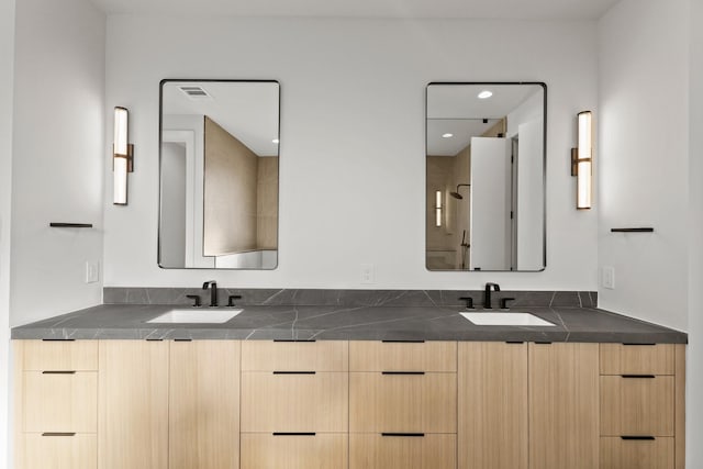 full bath with recessed lighting, visible vents, a sink, and double vanity