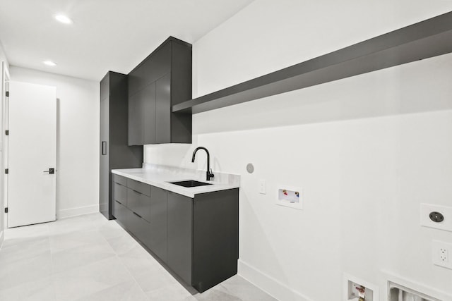 laundry room with hookup for a washing machine, recessed lighting, cabinet space, a sink, and electric dryer hookup