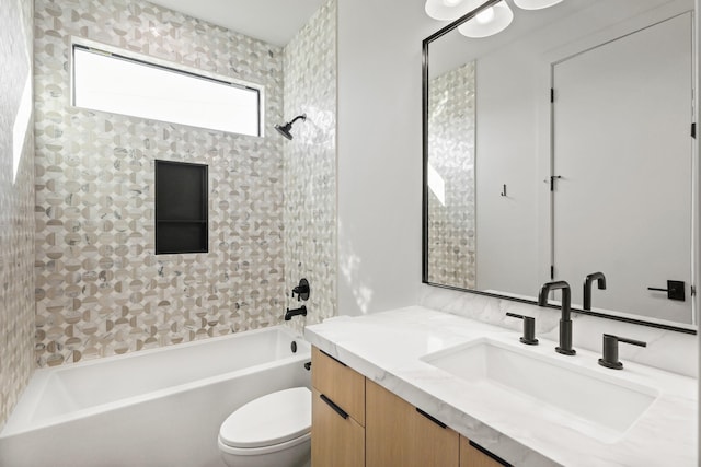 bathroom with shower / bathing tub combination, vanity, and toilet