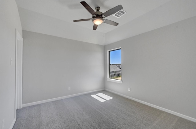 unfurnished room featuring a ceiling fan, carpet, visible vents, and baseboards