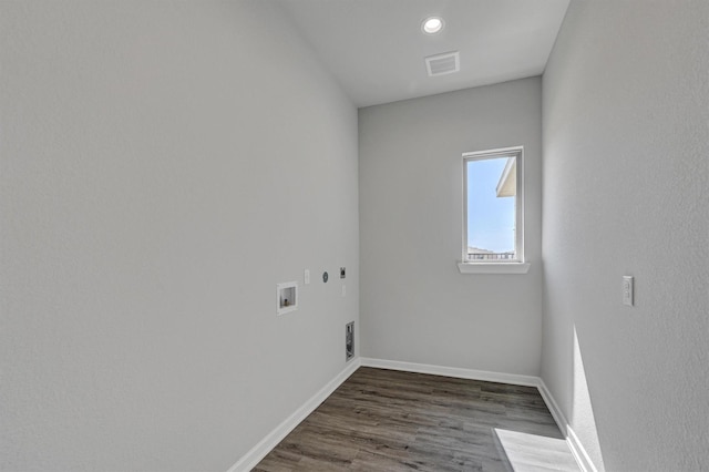 clothes washing area with laundry area, visible vents, baseboards, dark wood-style flooring, and hookup for a washing machine