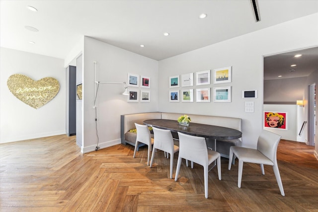 dining space featuring recessed lighting and baseboards