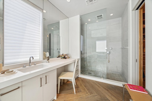 bathroom with vanity, a shower stall, visible vents, and recessed lighting