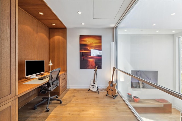 home office with baseboards, light wood-style flooring, and recessed lighting