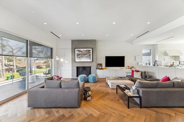 living area featuring a fireplace and recessed lighting