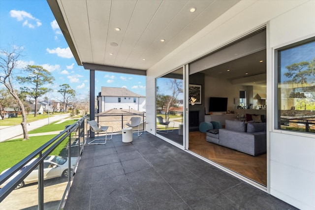 exterior space with a balcony and a residential view