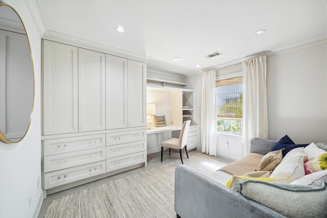 sitting room featuring recessed lighting, visible vents, ornamental molding, built in study area, and baseboards