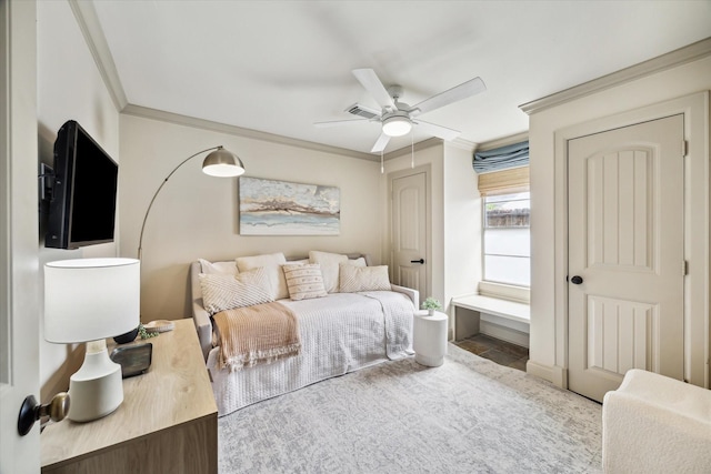 bedroom featuring visible vents, crown molding, and ceiling fan