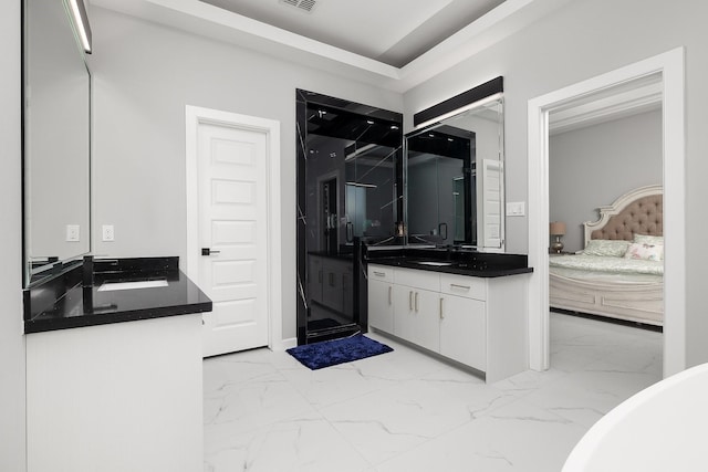 bathroom with marble finish floor, vanity, visible vents, and ensuite bathroom