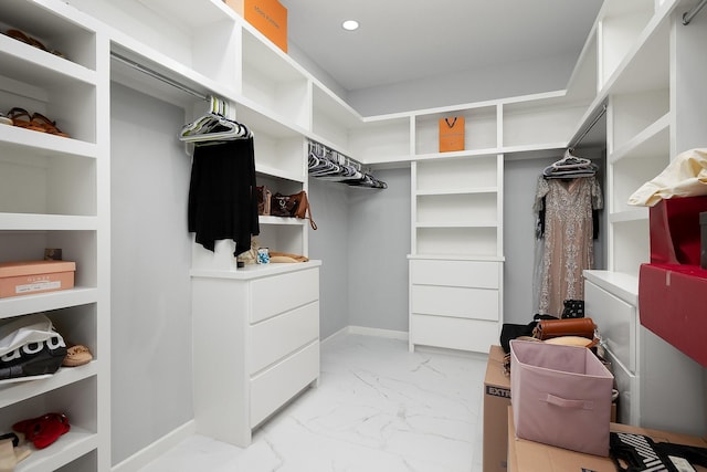 spacious closet with marble finish floor