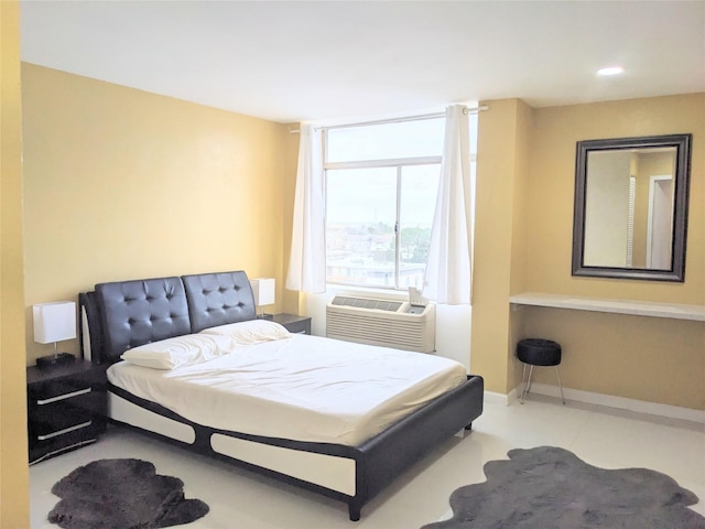 bedroom featuring recessed lighting, baseboards, and a wall mounted AC