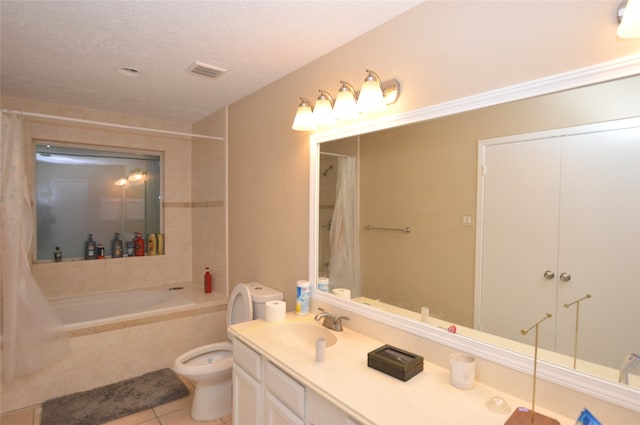 full bath with visible vents, toilet, tile patterned flooring, a textured ceiling, and vanity