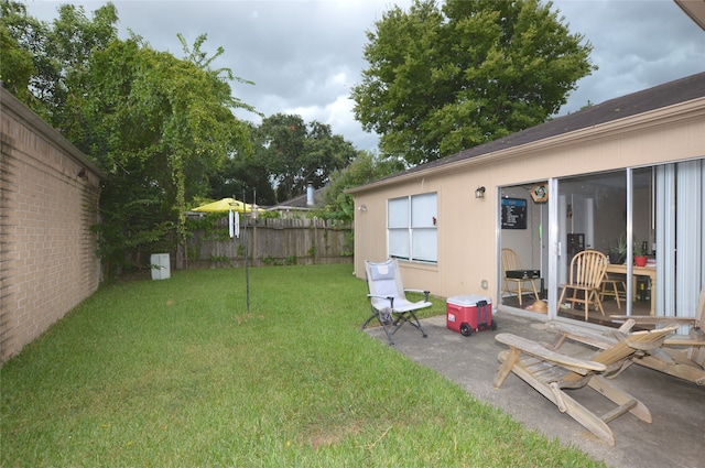 view of yard with a patio area and fence