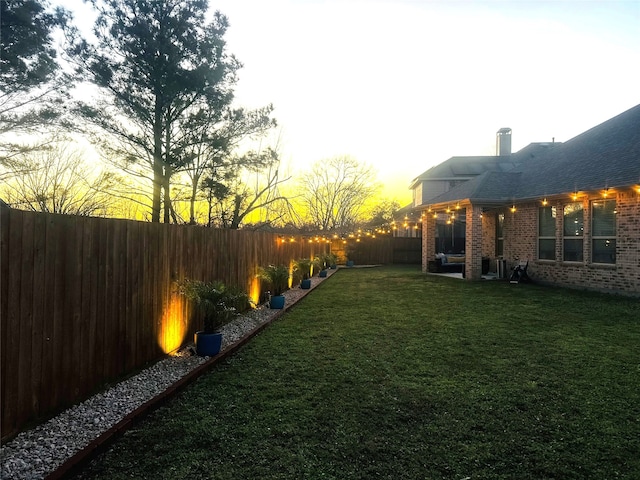 view of yard featuring a fenced backyard