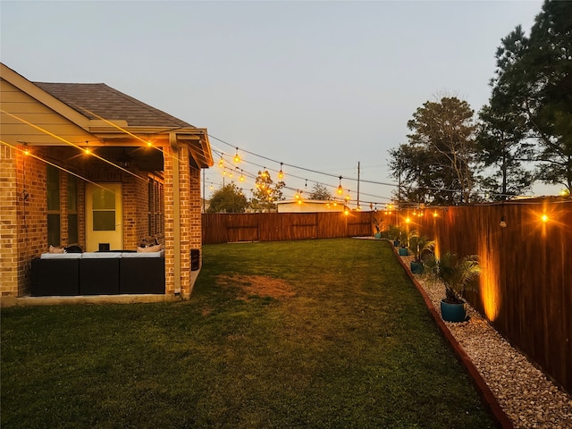 view of yard with a fenced backyard and an outdoor hangout area