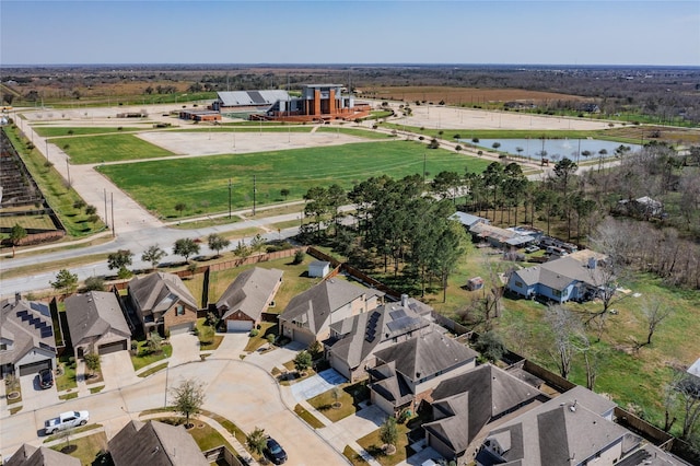 aerial view with a water view and a residential view