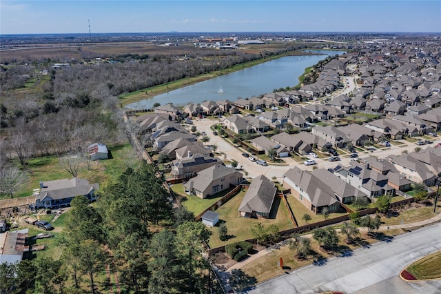 bird's eye view featuring a residential view and a water view