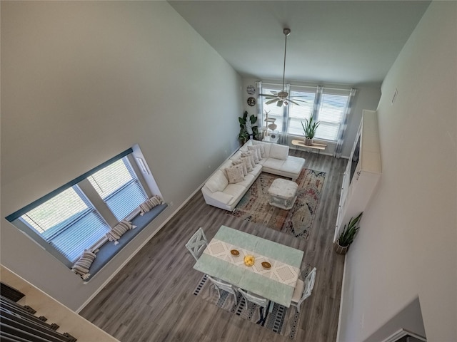 living room featuring baseboards and wood finished floors