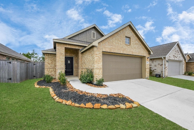 view of front facade with an attached garage, a front yard, fence, and brick siding