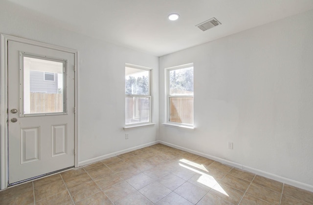 interior space featuring visible vents and baseboards