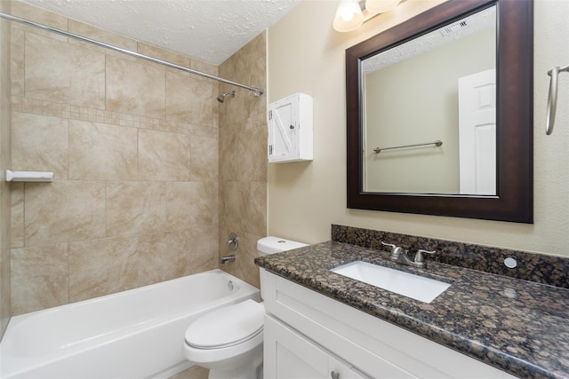 full bathroom with a textured ceiling, toilet, visible vents, vanity, and washtub / shower combination