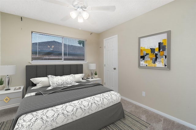 bedroom featuring carpet, baseboards, and ceiling fan