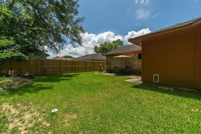 view of yard featuring a patio and fence