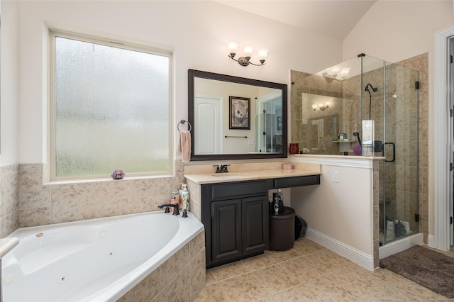 bathroom with a stall shower, tile patterned flooring, a jetted tub, and vanity