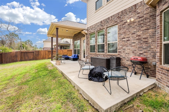 view of patio featuring outdoor lounge area and a fenced backyard