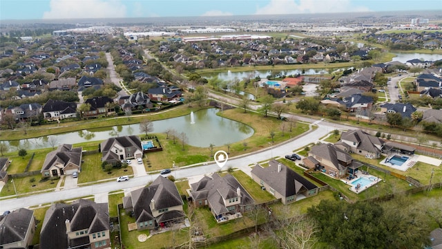 bird's eye view featuring a water view and a residential view