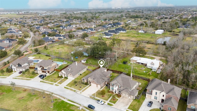 birds eye view of property with a residential view