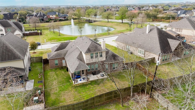 aerial view with a residential view and a water view