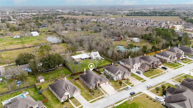 aerial view with a residential view and a water view