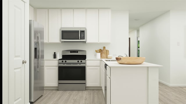 kitchen featuring stainless steel appliances, light wood-type flooring, white cabinets, and a peninsula