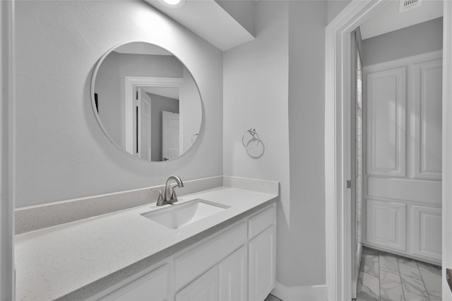 bathroom with visible vents, marble finish floor, and vanity