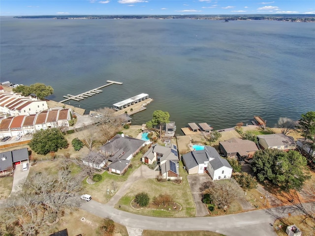 drone / aerial view featuring a water view and a residential view