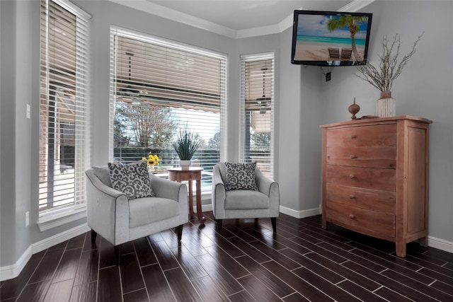 living area featuring ornamental molding, wood finish floors, plenty of natural light, and baseboards