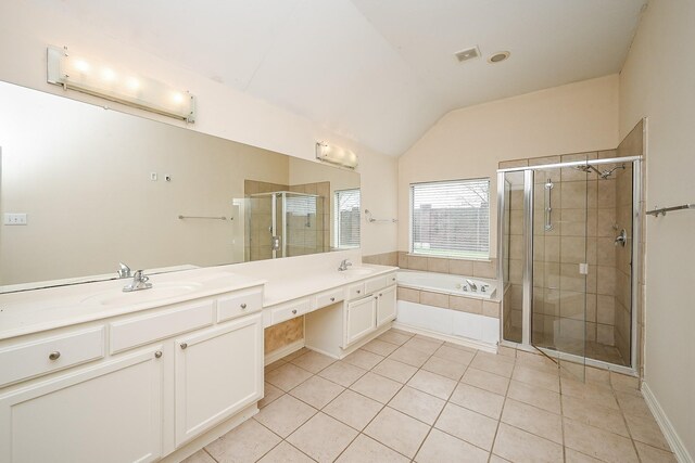 full bath with lofted ceiling, a sink, a shower stall, a bath, and double vanity