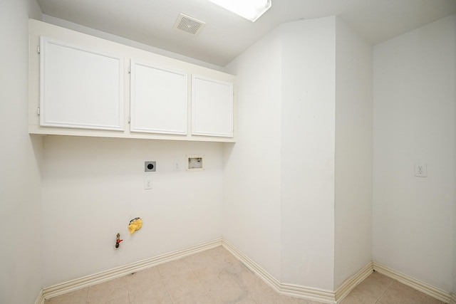 laundry room with hookup for an electric dryer, hookup for a gas dryer, washer hookup, visible vents, and baseboards