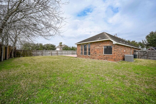 view of yard featuring cooling unit and a fenced backyard