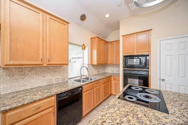 kitchen featuring light tile patterned floors, light brown cabinets, a sink, backsplash, and black appliances