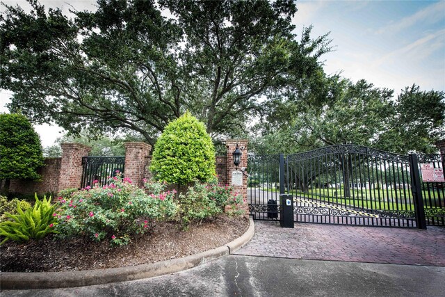 view of gate with fence