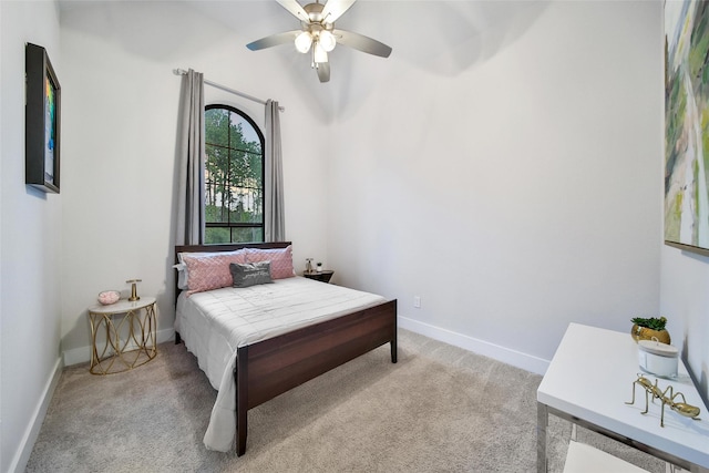 bedroom with carpet floors, baseboards, and a ceiling fan