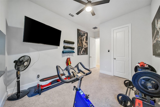 workout room featuring carpet floors, baseboards, and visible vents