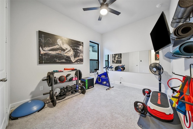 workout area featuring carpet floors, baseboards, and a ceiling fan