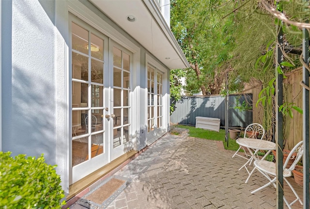 view of patio with a fenced backyard and french doors