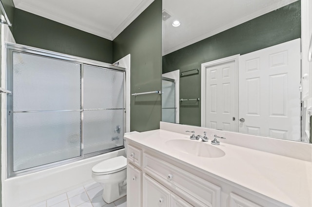 full bathroom featuring toilet, enclosed tub / shower combo, ornamental molding, tile patterned floors, and vanity