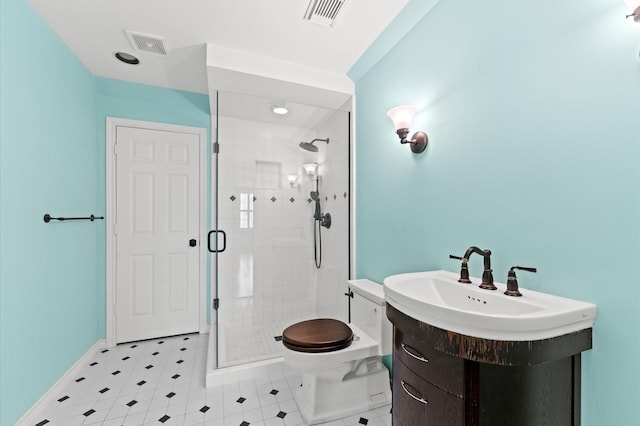 full bathroom featuring a stall shower, baseboards, visible vents, and toilet