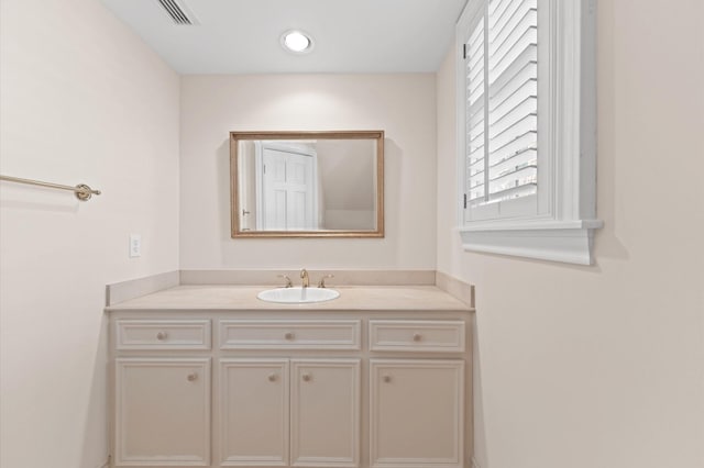 bathroom featuring vanity and visible vents