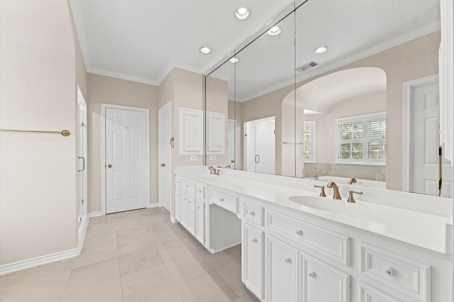 full bathroom with double vanity, ornamental molding, a sink, and visible vents